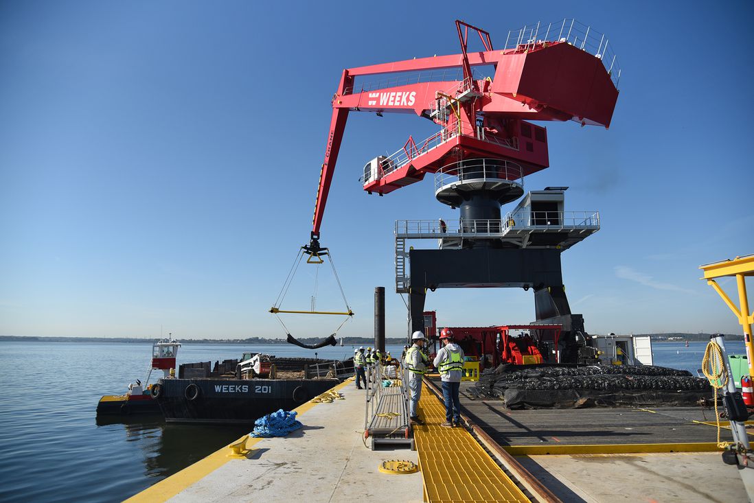The equilibrium crane sits atop a 250-foot-long barge, which is moored in the shallow waters of Raritan Bay, October 27th, 2021.